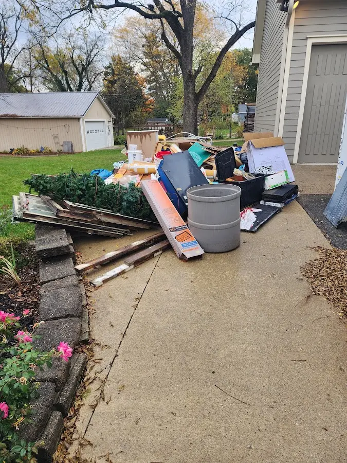Dumpster being loaded with debris for Demolition Dumpster Rental in East Chicago